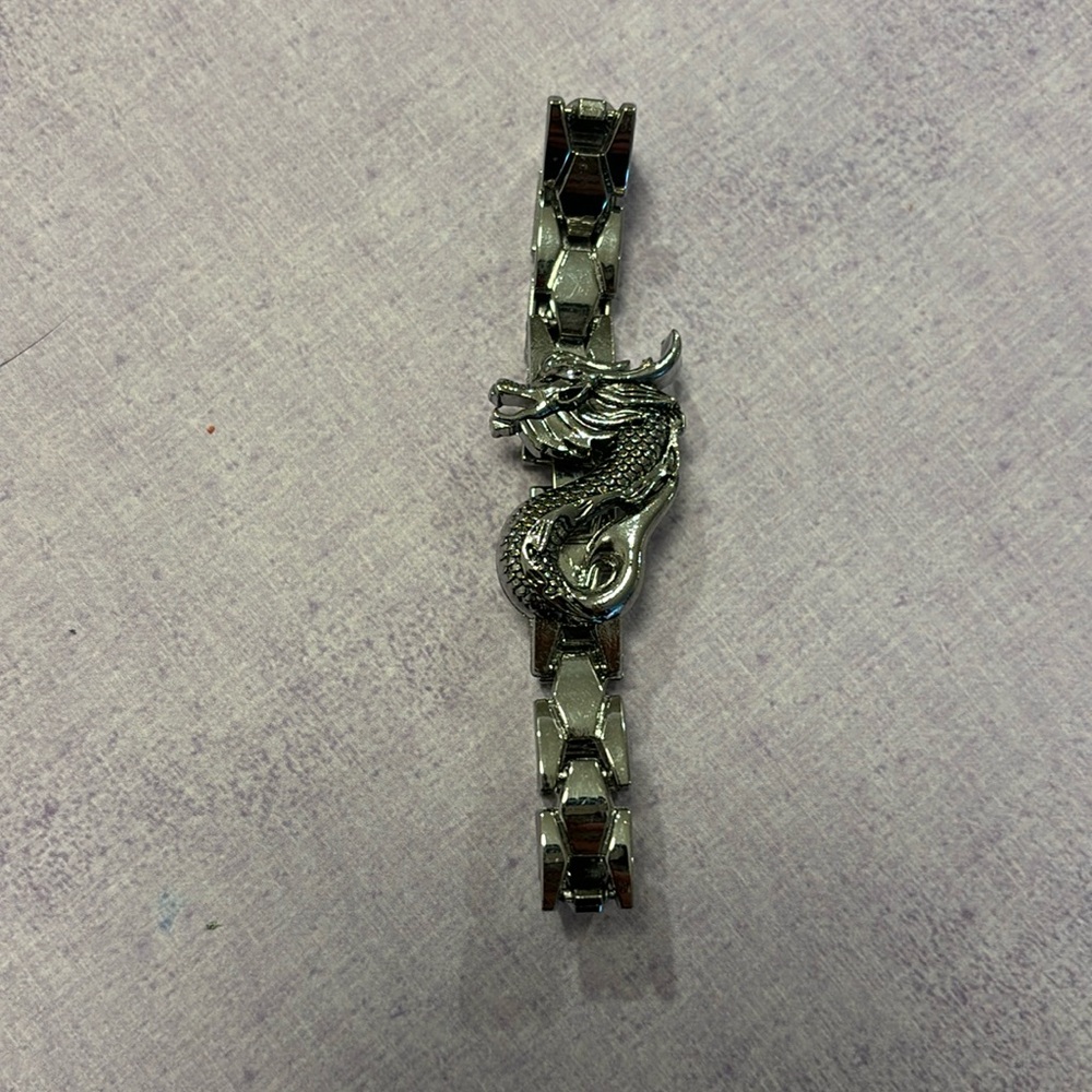 stainless steel dragon bracelet (lighting makes it look warm toned)
